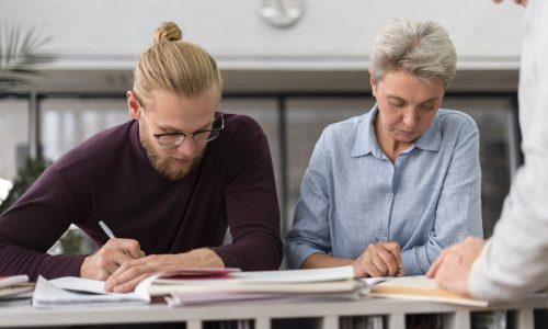 close-up-people-taking-notes